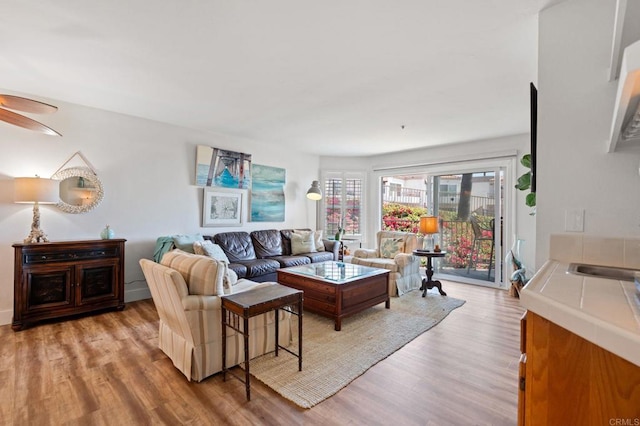600 N The Strand Unit 3, Oceanside, CA 92054 - living room with light wood finished floors and a ceiling fan