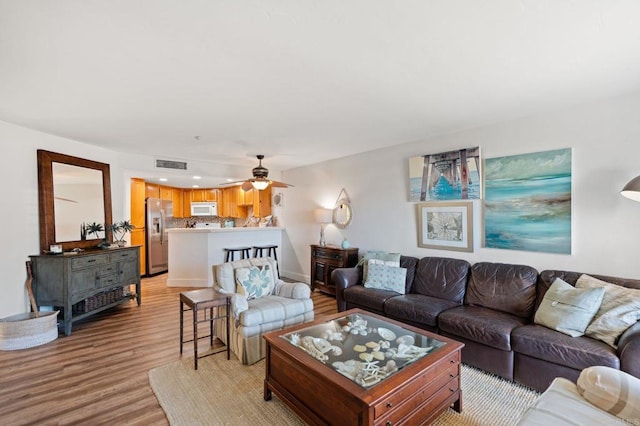 600 N The Strand Unit 3, Oceanside, CA 92054 - living room with light wood-style flooring and ceiling fan