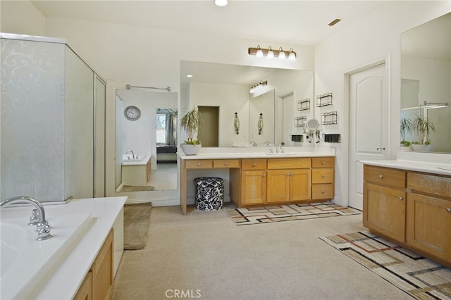 2983 Orchid Ln, Turlock, CA 95382 - bathroom featuring a stall shower, vanity, a bath, and recessed lighting