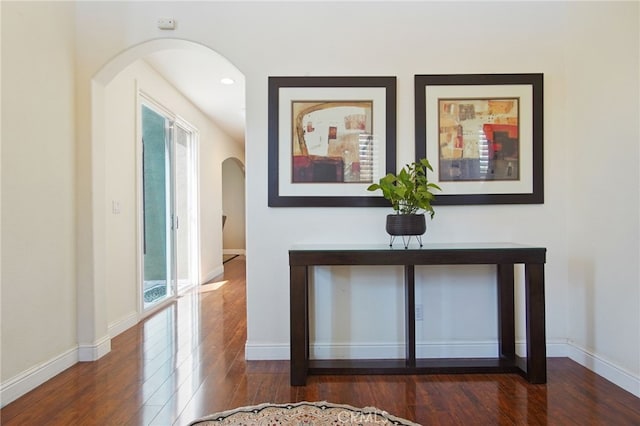 2983 Orchid Ln, Turlock, CA 95382 - corridor featuring arched walkways, wood finished floors, and baseboards