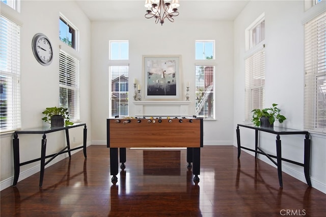2983 Orchid Ln, Turlock, CA 95382 - entryway featuring a chandelier, wood finished floors, and baseboards