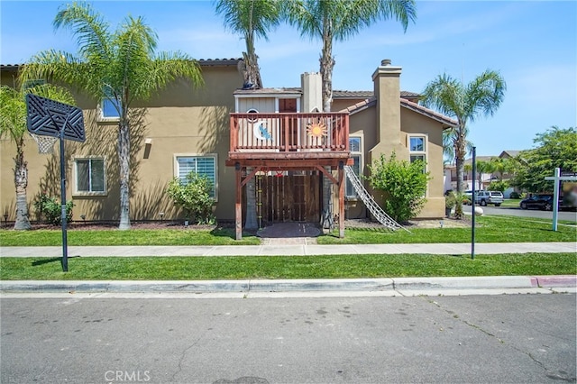 2983 Orchid Ln, Turlock, CA 95382 - view of front of home featuring stucco siding, a chimney, stairway, and a tile roof
