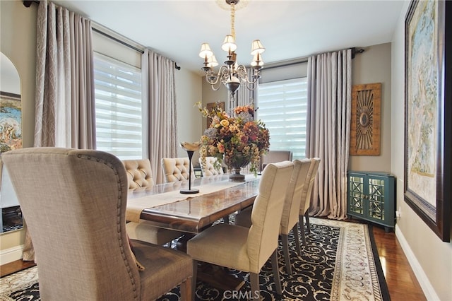 2983 Orchid Ln, Turlock, CA 95382 - dining space with a chandelier, wood finished floors, and baseboards