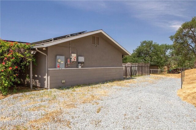 33708 Bronco Ln, Squaw Valley, CA 93675 - view of side of home featuring stucco siding