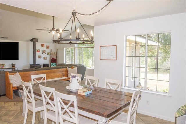 33708 Bronco Ln, Squaw Valley, CA 93675 - dining space featuring light tile patterned floors, plenty of natural light, a chandelier, and vaulted ceiling
