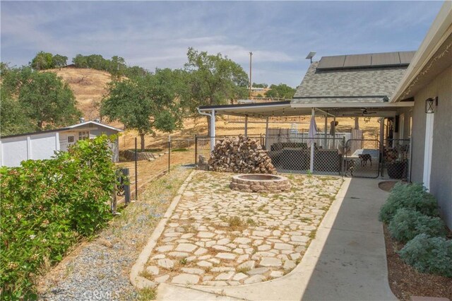 33708 Bronco Ln, Squaw Valley, CA 93675 - fenced backyard with a gate, an outdoor fire pit, and a patio