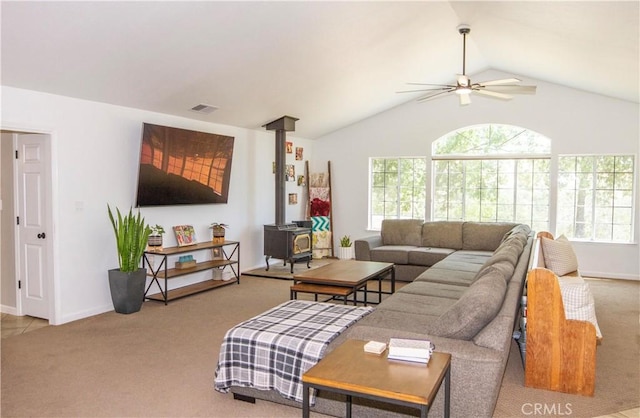 33708 Bronco Ln, Squaw Valley, CA 93675 - living area featuring a ceiling fan, carpet, lofted ceiling, a wood stove, and baseboards