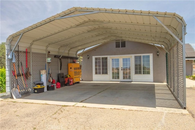 33708 Bronco Ln, Squaw Valley, CA 93675 - back of house featuring stucco siding, a carport, and french doors