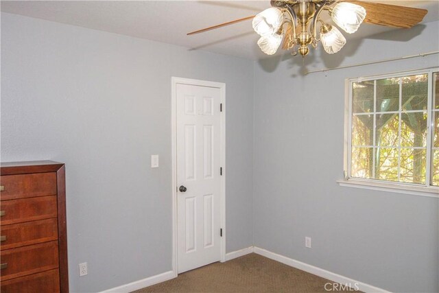 33708 Bronco Ln, Squaw Valley, CA 93675 - unfurnished bedroom with carpet floors, baseboards, and a ceiling fan