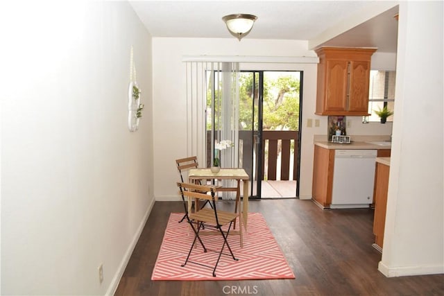 15351 Orange Ave Unit 25, Paramount, CA 90723 - dining space with dark wood-style floors and baseboards