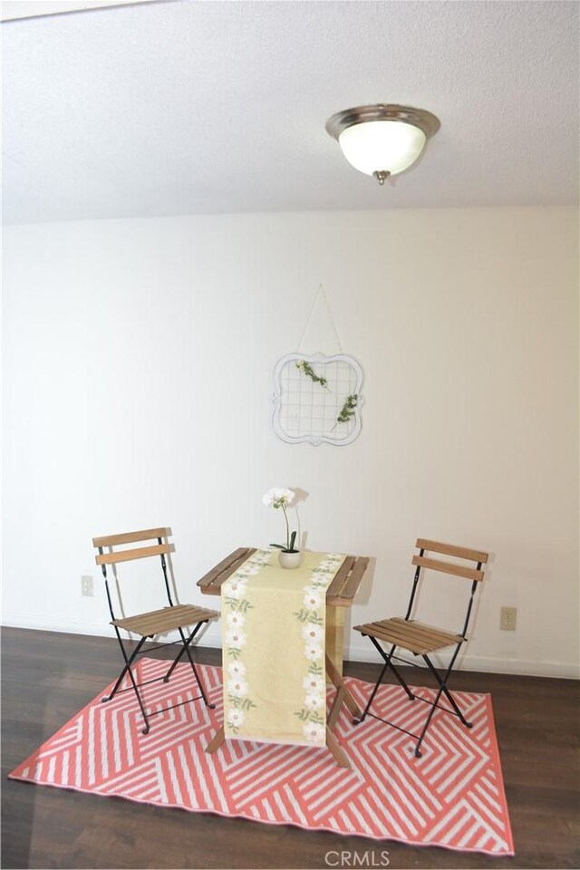 15351 Orange Ave Unit 25, Paramount, CA 90723 - living area with wood finished floors and a textured ceiling