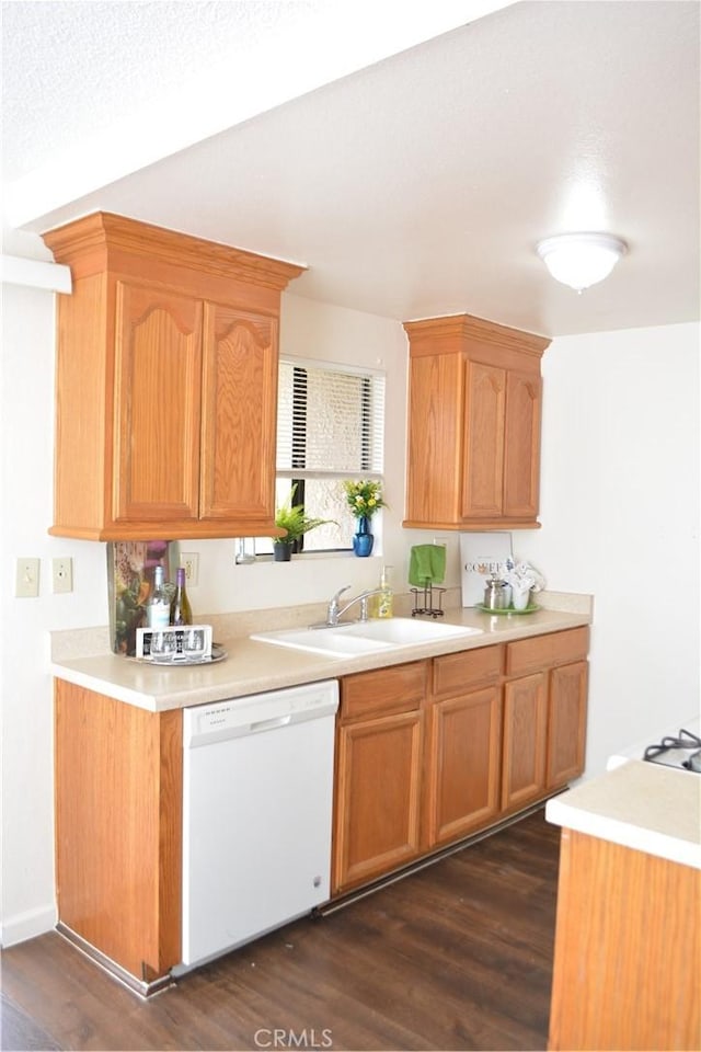 15351 Orange Ave Unit 25, Paramount, CA 90723 - kitchen with dishwasher, light countertops, a sink, and dark wood-type flooring