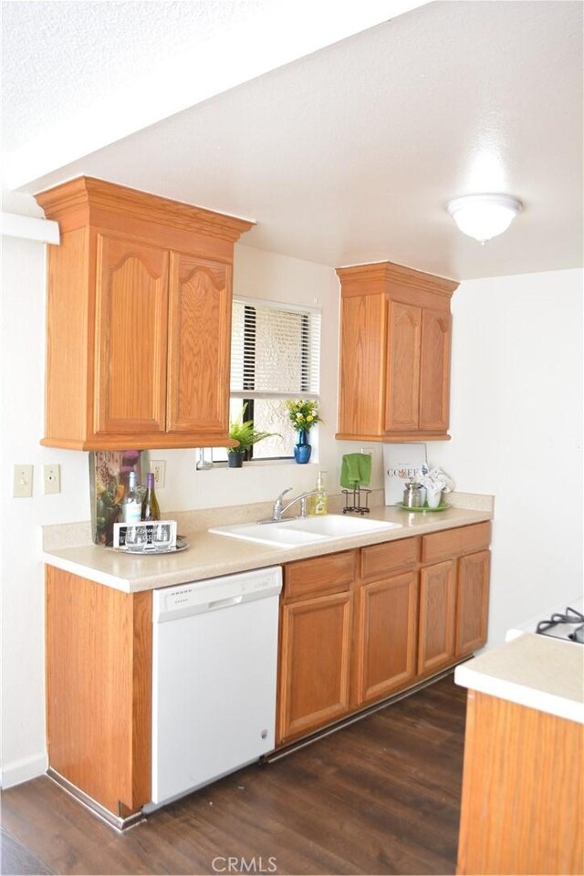 15351 Orange Ave Unit 25, Paramount, CA 90723 - kitchen with white dishwasher, light countertops, and dark wood-type flooring