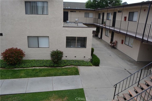 15351 Orange Ave Unit 25, Paramount, CA 90723 - view of property featuring stairway
