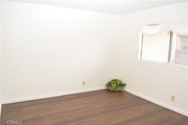 15351 Orange Ave Unit 25, Paramount, CA 90723 - unfurnished room with baseboards and dark wood-style floors