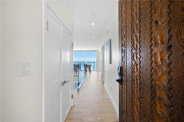 11938 Whitewater Ln, Malibu, CA 90265 - corridor with light wood finished floors, baseboards, and recessed lighting