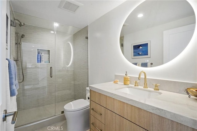 11938 Whitewater Ln, Malibu, CA 90265 - full bath featuring vanity, toilet, a shower stall, and recessed lighting
