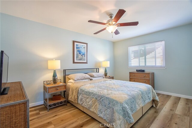 27071 Crews Hill Dr, Menifee, CA 92586 - bedroom with light wood-style flooring, baseboards, and a ceiling fan