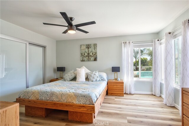 27071 Crews Hill Dr, Menifee, CA 92586 - bedroom featuring wood finished floors, ceiling fan, baseboards, and a closet