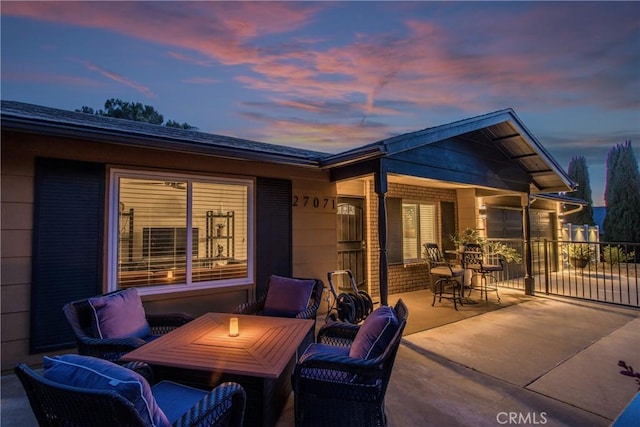 27071 Crews Hill Dr, Menifee, CA 92586 - patio terrace at dusk featuring a patio and a garage