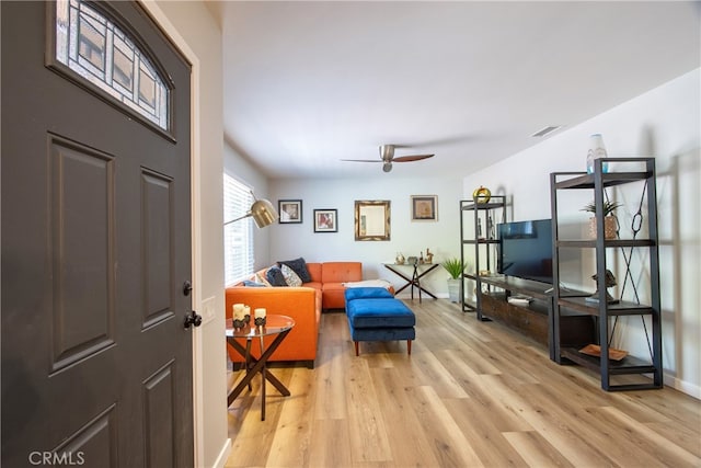 27071 Crews Hill Dr, Menifee, CA 92586 - living area with light wood-style floors, a ceiling fan, and baseboards