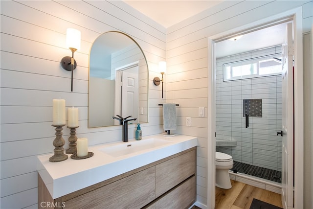 27071 Crews Hill Dr, Menifee, CA 92586 - full bathroom with toilet, a shower stall, vanity, wood finished floors, and wooden walls