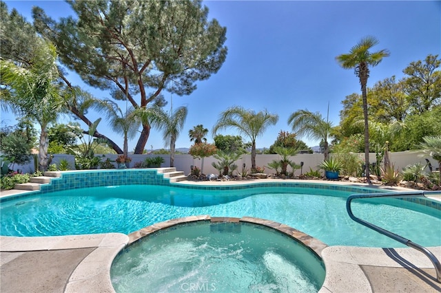 27071 Crews Hill Dr, Menifee, CA 92586 - view of pool featuring a pool with connected hot tub and a fenced backyard