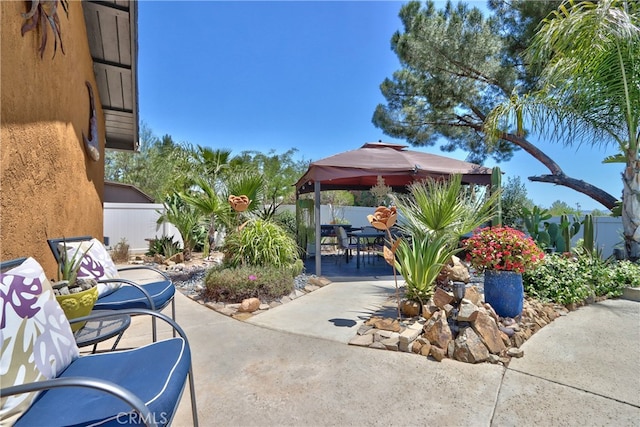 27071 Crews Hill Dr, Menifee, CA 92586 - fenced backyard featuring a gazebo, a patio area, and outdoor dining space