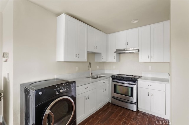 10010 S San Pedro St, Los Angeles, CA 90003 - kitchen with washer / clothes dryer, gas stove, a sink, under cabinet range hood, and dark wood-style floors
