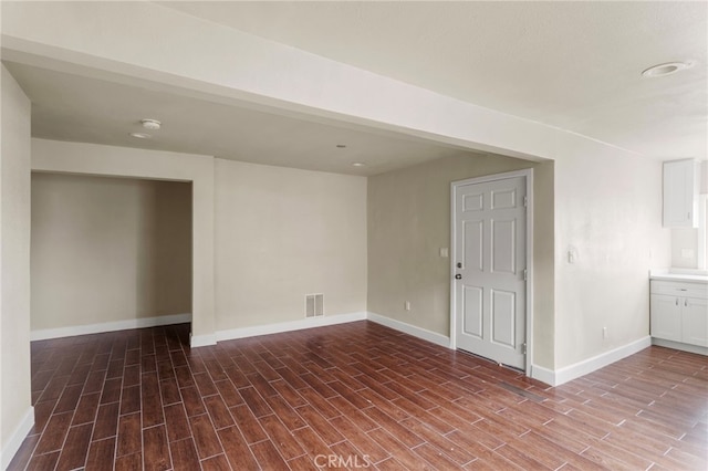 10010 S San Pedro St, Los Angeles, CA 90003 - empty room featuring wood finished floors and baseboards