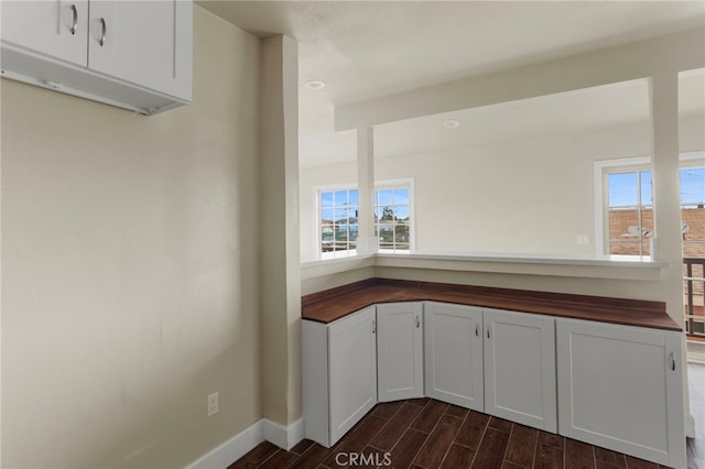 10010 S San Pedro St, Los Angeles, CA 90003 - kitchen with wood counters, wood finish floors, plenty of natural light, and baseboards
