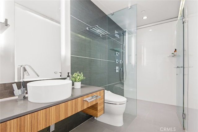 121 S Hope St Unit 9, Los Angeles, CA 90012 - full bathroom with tile patterned flooring, walk in shower, vanity, toilet, and recessed lighting