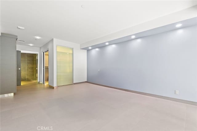121 S Hope St Unit 9, Los Angeles, CA 90012 - spare room with recessed lighting and baseboards