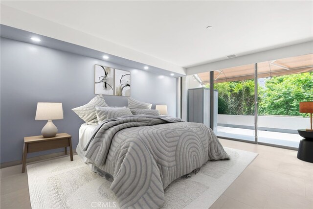 121 S Hope St Unit 9, Los Angeles, CA 90012 - bedroom with access to exterior and recessed lighting