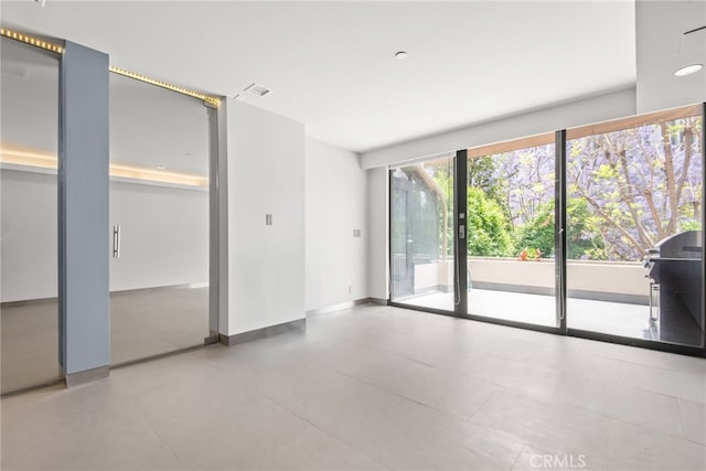 121 S Hope St Unit 9, Los Angeles, CA 90012 - empty room featuring baseboards
