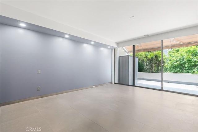 121 S Hope St Unit 9, Los Angeles, CA 90012 - empty room featuring recessed lighting, concrete flooring, and baseboards