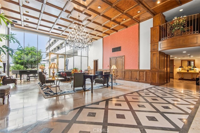 121 S Hope St Unit 9, Los Angeles, CA 90012 - building lobby featuring a towering ceiling, coffered ceiling, and recessed lighting