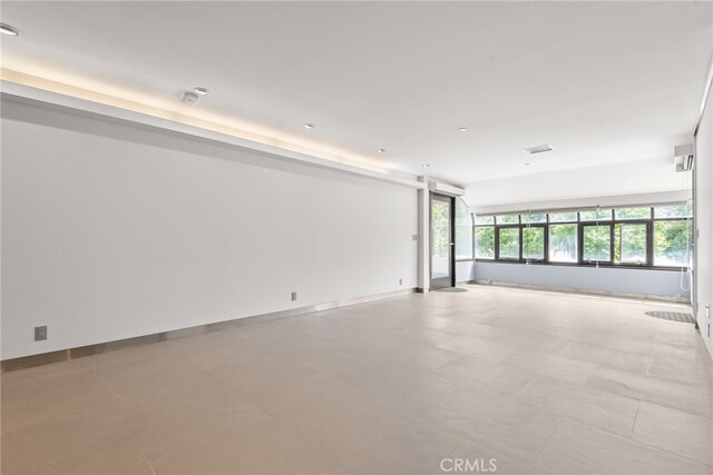 121 S Hope St Unit 9, Los Angeles, CA 90012 - spare room featuring baseboards