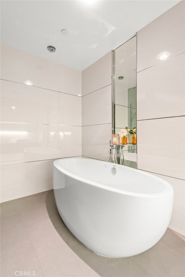 121 S Hope St Unit 9, Los Angeles, CA 90012 - full bathroom featuring tile patterned floors and a freestanding tub