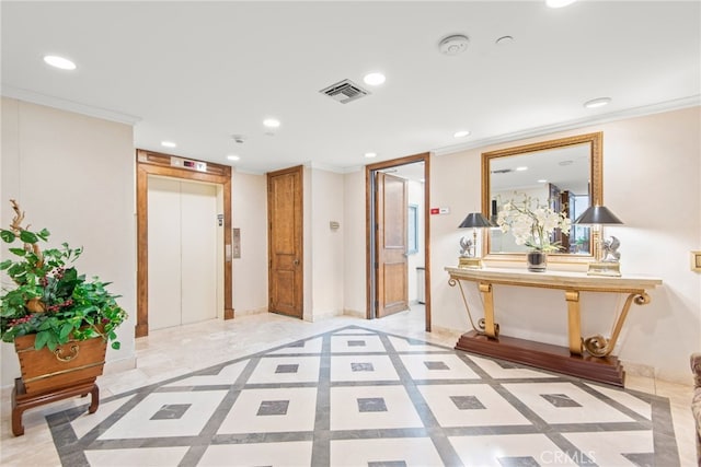 121 S Hope St Unit 9, Los Angeles, CA 90012 - foyer with inlaid floor details, elevator, recessed lighting, crown molding, and baseboards