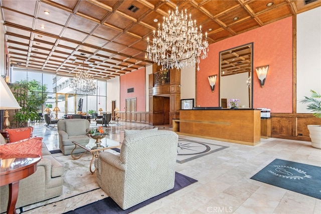 121 S Hope St Unit 9, Los Angeles, CA 90012 - building lobby featuring coffered ceiling, a high ceiling, and recessed lighting