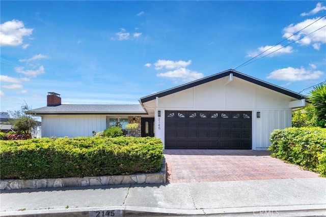 2145 Mcrae Dr, San Pedro, CA 90732 - single story home with a chimney, a garage, and driveway
