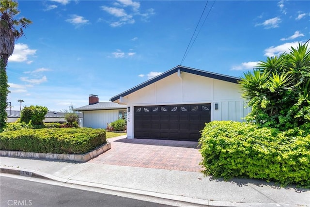 2145 Mcrae Dr, San Pedro, CA 90732 - ranch-style house featuring an attached garage, decorative driveway, and a chimney