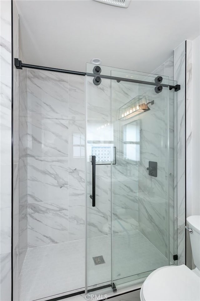2145 Mcrae Dr, San Pedro, CA 90732 - bathroom with toilet and a marble finish shower