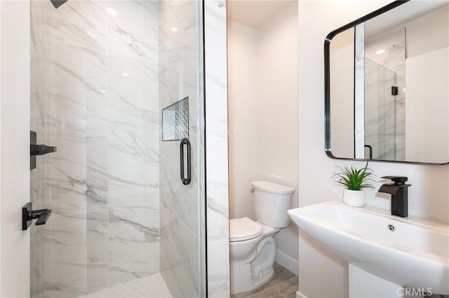 2145 Mcrae Dr, San Pedro, CA 90732 - full bath with toilet, a sink, a marble finish shower, and baseboards