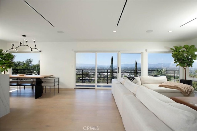 3863 Sherwood Pl, Sherman Oaks, CA 91423 - living room with healthy amount of natural light, wood finished floors, and recessed lighting