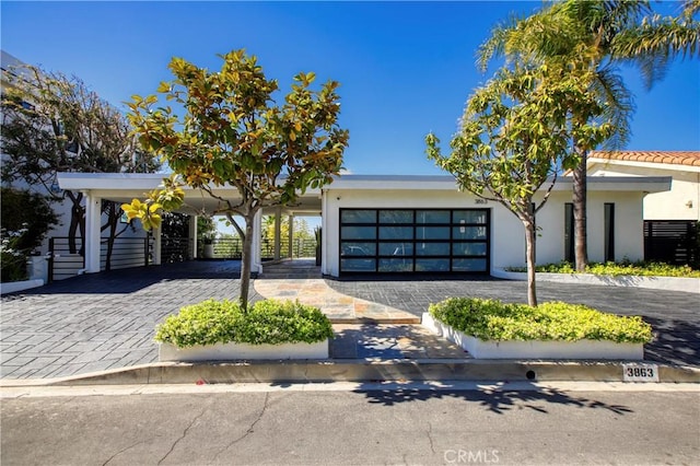 3863 Sherwood Pl, Sherman Oaks, CA 91423 - view of front of home with decorative driveway, stucco siding, and an attached garage