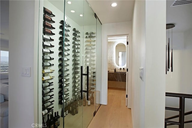 3863 Sherwood Pl, Sherman Oaks, CA 91423 - wine area featuring light wood-style floors and recessed lighting