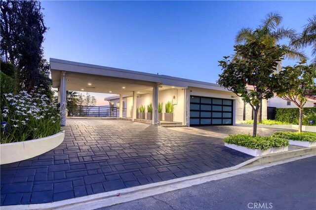 3863 Sherwood Pl, Sherman Oaks, CA 91423 - view of front of property with a garage, stucco siding, and decorative driveway