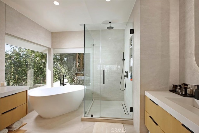 3863 Sherwood Pl, Sherman Oaks, CA 91423 - bathroom featuring vanity, a shower stall, a soaking tub, and tile patterned floors